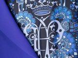 a close up of a blue tie with a black background
