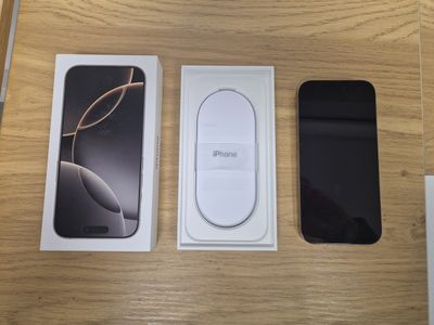 two iphones sitting on a table next to each other
