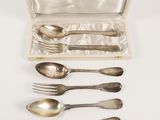 an assortment of silverware including spoons, forks and spoons