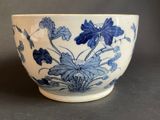 a blue and white bowl with blue flowers on it