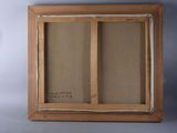 an old picture frame with a picture of a cat in it