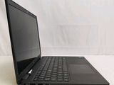 a black laptop computer sitting on a white surface
