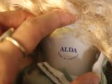 a person that is holding a ball of hair