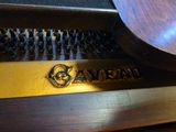 a close up of a piano with the name on it