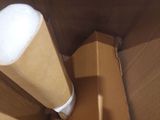 a cardboard box with a roll of toilet paper inside of it