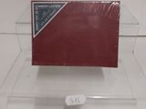 a red card holder with a flag on it