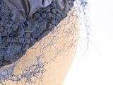 a close up of a hat on a mannequin head