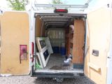 a white van that has a door open in the back of it