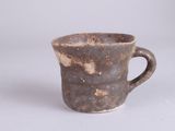 a coffee cup that is sitting on a table