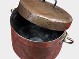 a red pot with a lid on a white background