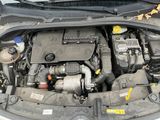 the engine of a car with its hood open and the hood down