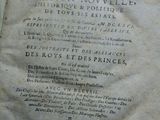 an old book that is open on a table