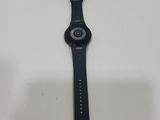 a close up of a watch on a table with a white background