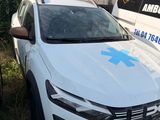 a white car with a blue star on the front parked in front of a building