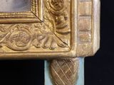 a picture of a gold picture frame on a black background