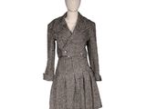 the mannequin is wearing a black and white checkered coat and dress
