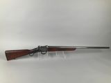 a rifle with a wooden barrel and a wooden handle on a white background