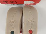 two pairs of shoes are in a red box on a white surface