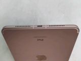 the back of a gold ipad with a small screen on top of it