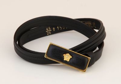 black leather bracelet with a gold plated apple on it