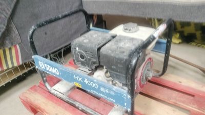 a small engine on a pallet in a warehouse