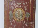 an old book with a picture of a woman on it