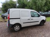 a small white van parked in a parking lot