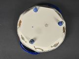 a blue and white plate with blue decorations on it