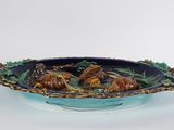blue and green ceramic bowl with two birds on it