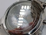 a close up of a watch on a white surface