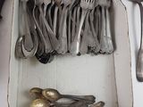 a box of silverware with spoons and spoons in it