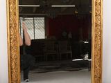 a woman taking a picture of herself in a mirror