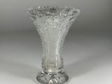 a glass vase that is sitting on a table