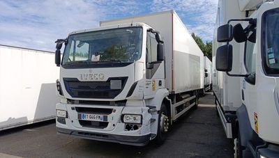 two trucks parked next to each other in a parking lot