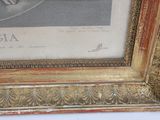 a picture of a man riding a horse in a gold frame