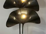 a lamp that is sitting on a stand in a room