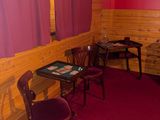 two chairs and a table in the corner of a room