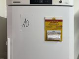 a white refrigerator with a sticker on it in a kitchen