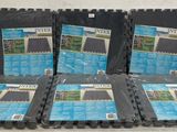 four black plastic trays with blue and white photos on them