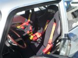 a car with a seat belt in the back of it