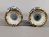 pair of blue and white porcelain vases with gold rims