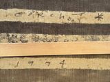 a picture of a piece of wood on a piece of fabric