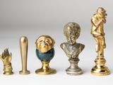 five different types of statues on a white surface