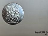 une image représentant une pièce d'argent sur laquelle figure un homme à cheval