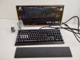 a computer keyboard and mouse sitting on a table