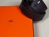 an orange box with a black belt on top of it