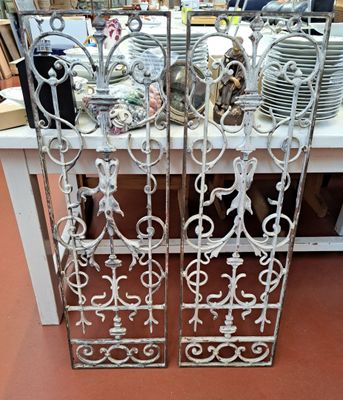 pair of antique wrought iron doors with decorative designs