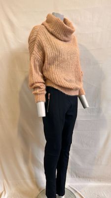 an image of a mannequin wearing a sweater and pants