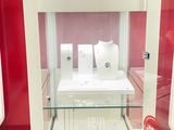 a glass display case with jewelry inside of it