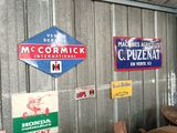 many different signs on the wall of a building